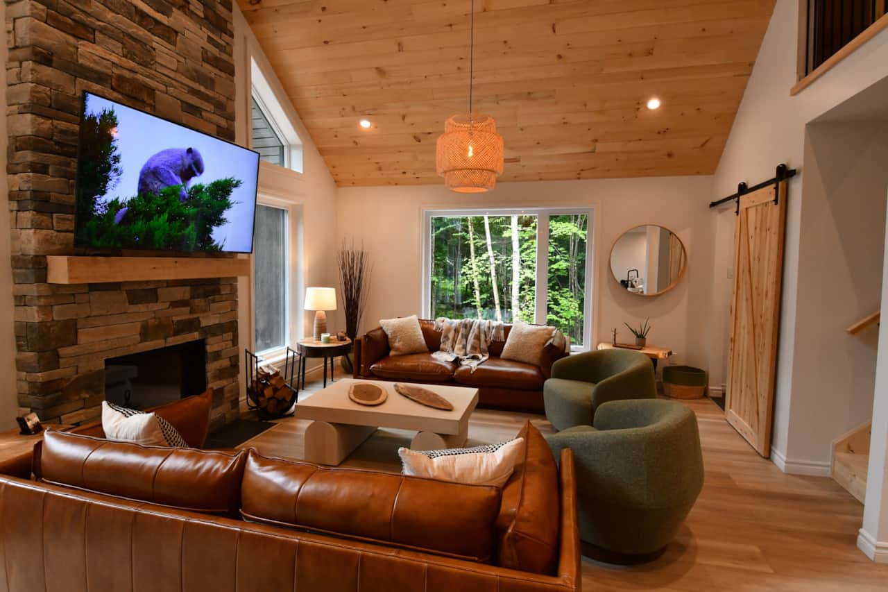Open-concept living room with wood-burning fireplace