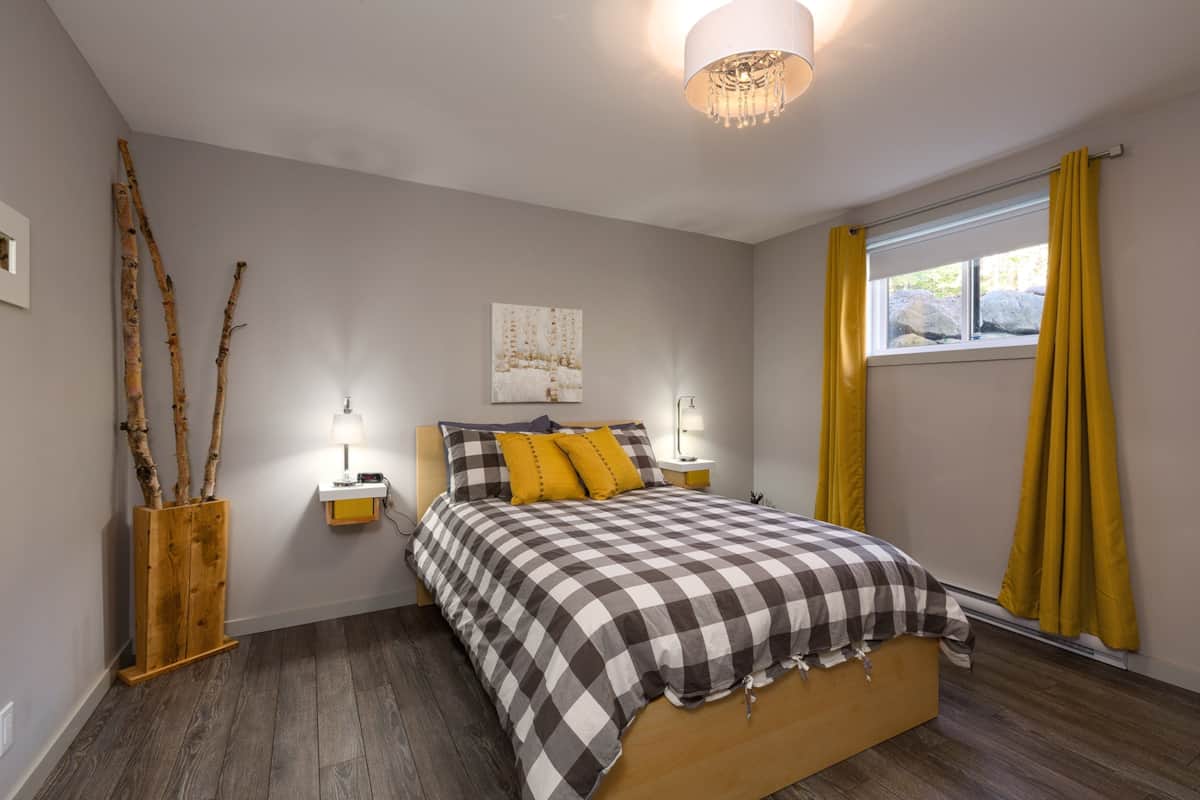 2nd bedroom with a double bed and storage