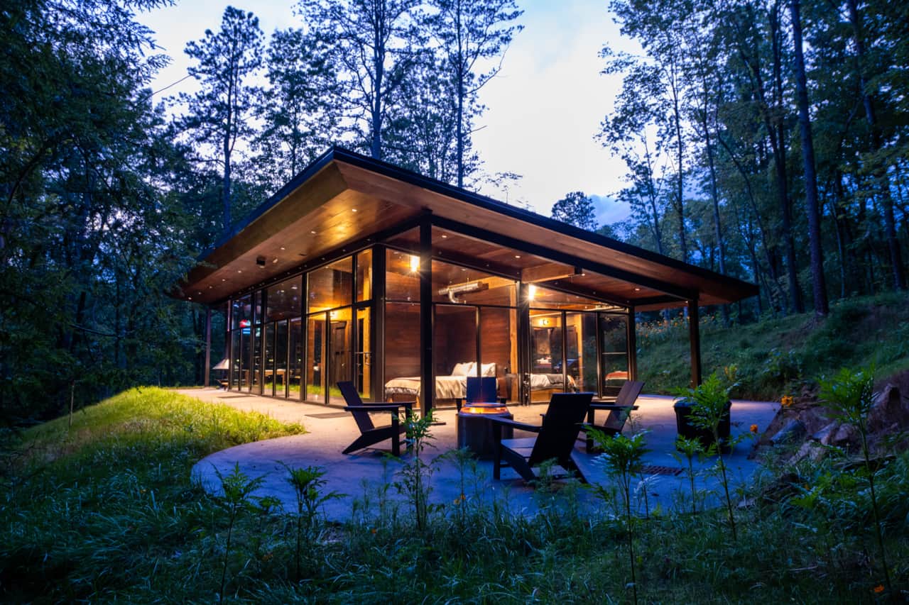 Smokeless firepit and cabin at dusk