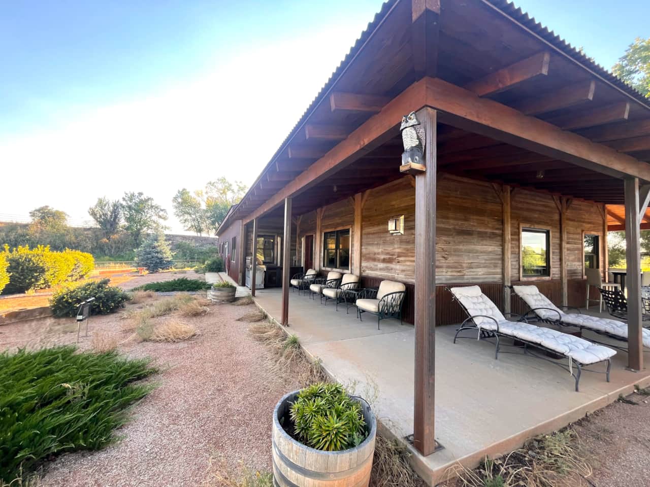 Exterior view of Hidden River Retreat - overview of lot and pond from outdoor covered patio