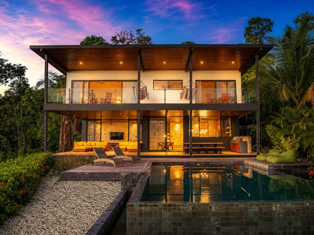 As the sun sets, the villa comes to life with warm lighting, creating the perfect setting for unforgettable evenings in your private tropical retreat.