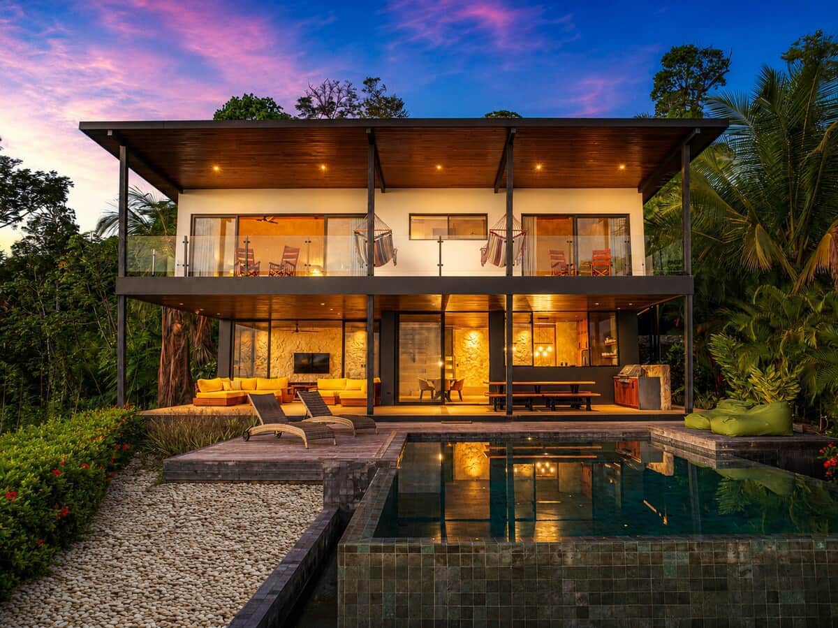 As the sun sets, the villa comes to life with warm lighting, creating the perfect setting for unforgettable evenings in your private tropical retreat.