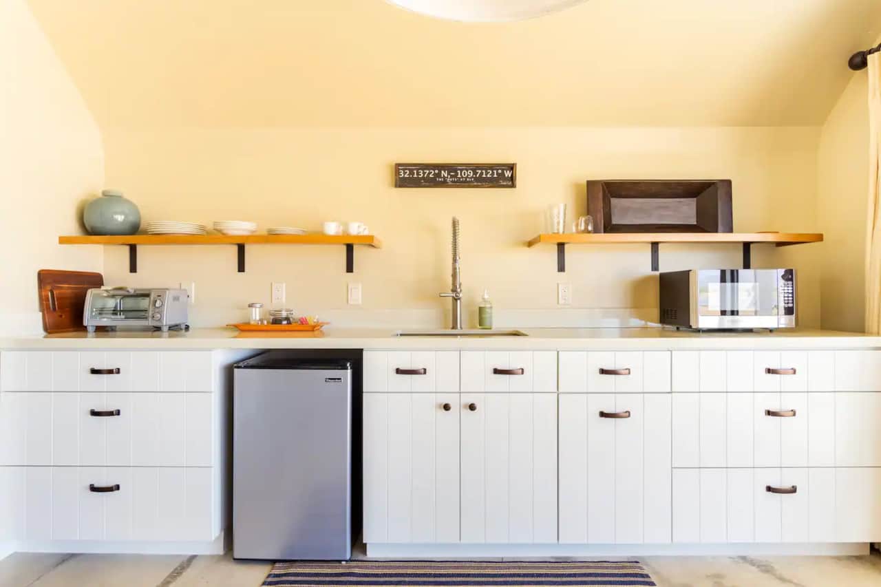 Kitchenette with toaster oven, microwave, and coffee pot