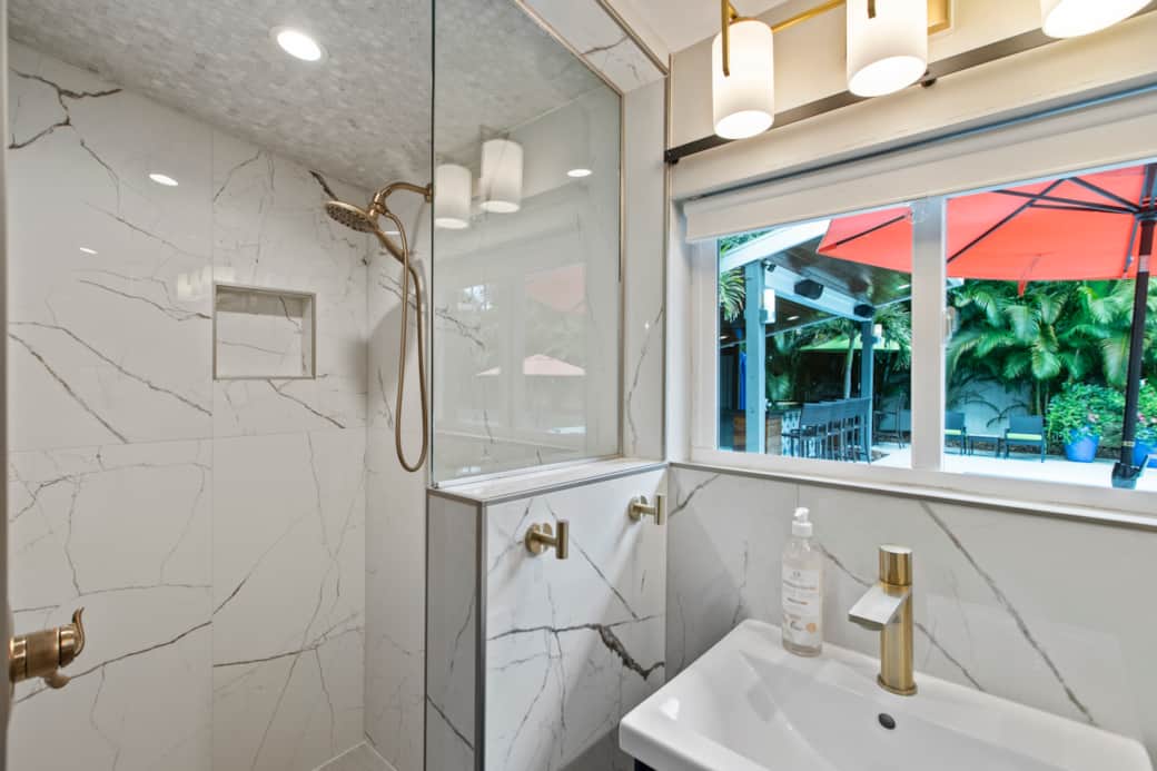 Poolside Hideaway Shower with view to the backyard from the window. Poolside Hideaway Shower with view to the backyard from the window.