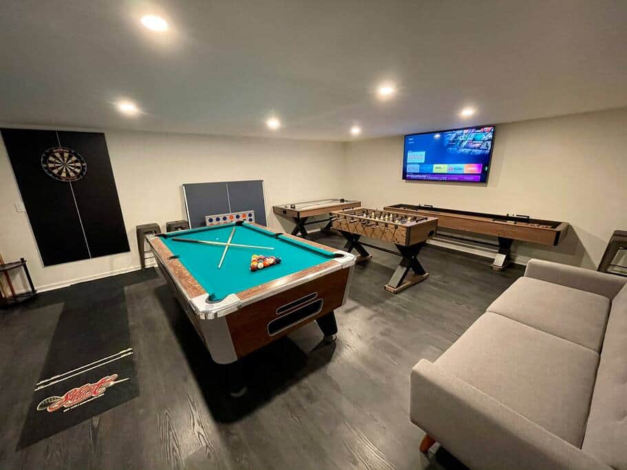 Game room! Complete with pool table, darts, foosball, air hockey and shuffle board. Game room! Complete with pool table, darts, foosball, air hockey and shuffle board.