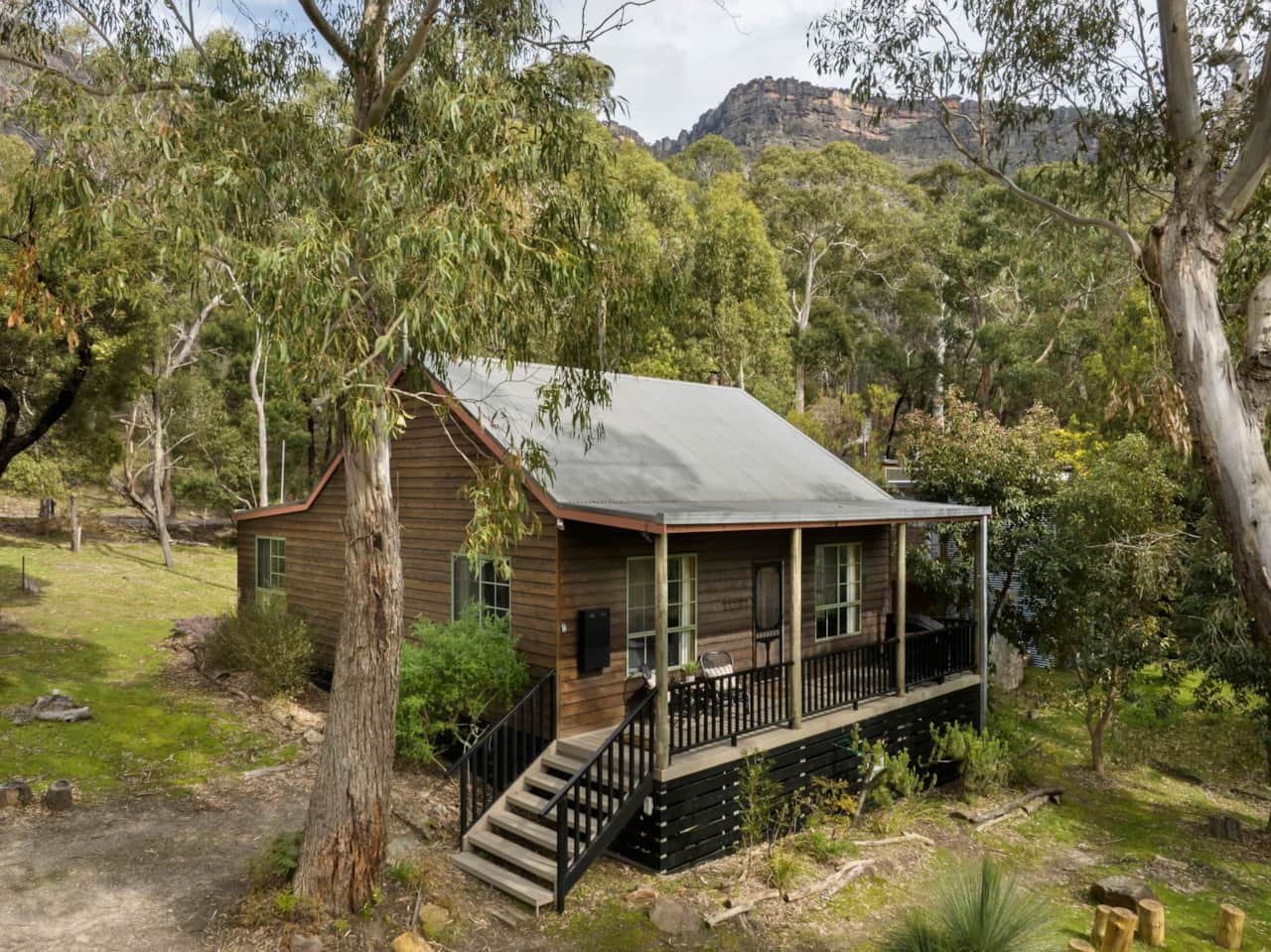 Nestled in serene bushland with outdoor fire pit and seasonal creek, a perfect rustic retreat.