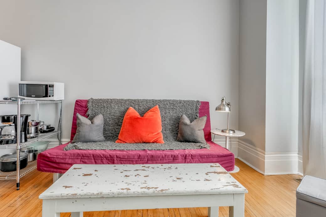 Welcoming living room in a Toronto short-term rental, bathed in natural light.