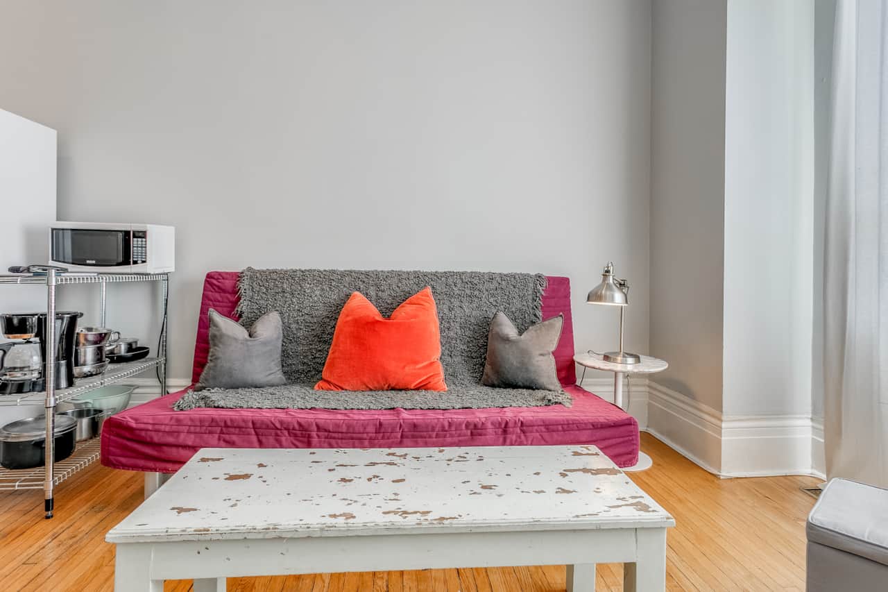 Welcoming living room in a Toronto short-term rental, bathed in natural light.