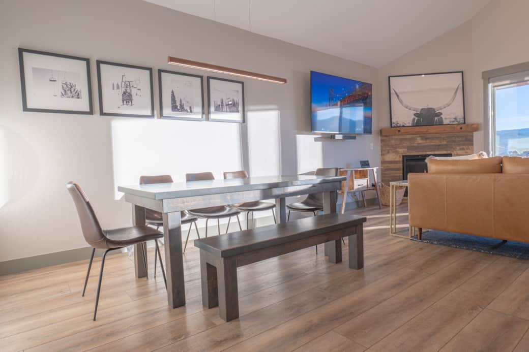 The dining area offers comfortable seating for eight, with three additional seats at the island. 00.