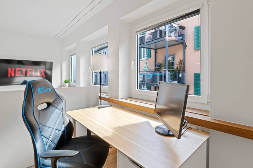 Desk with monitor by the window – perfect for home office.