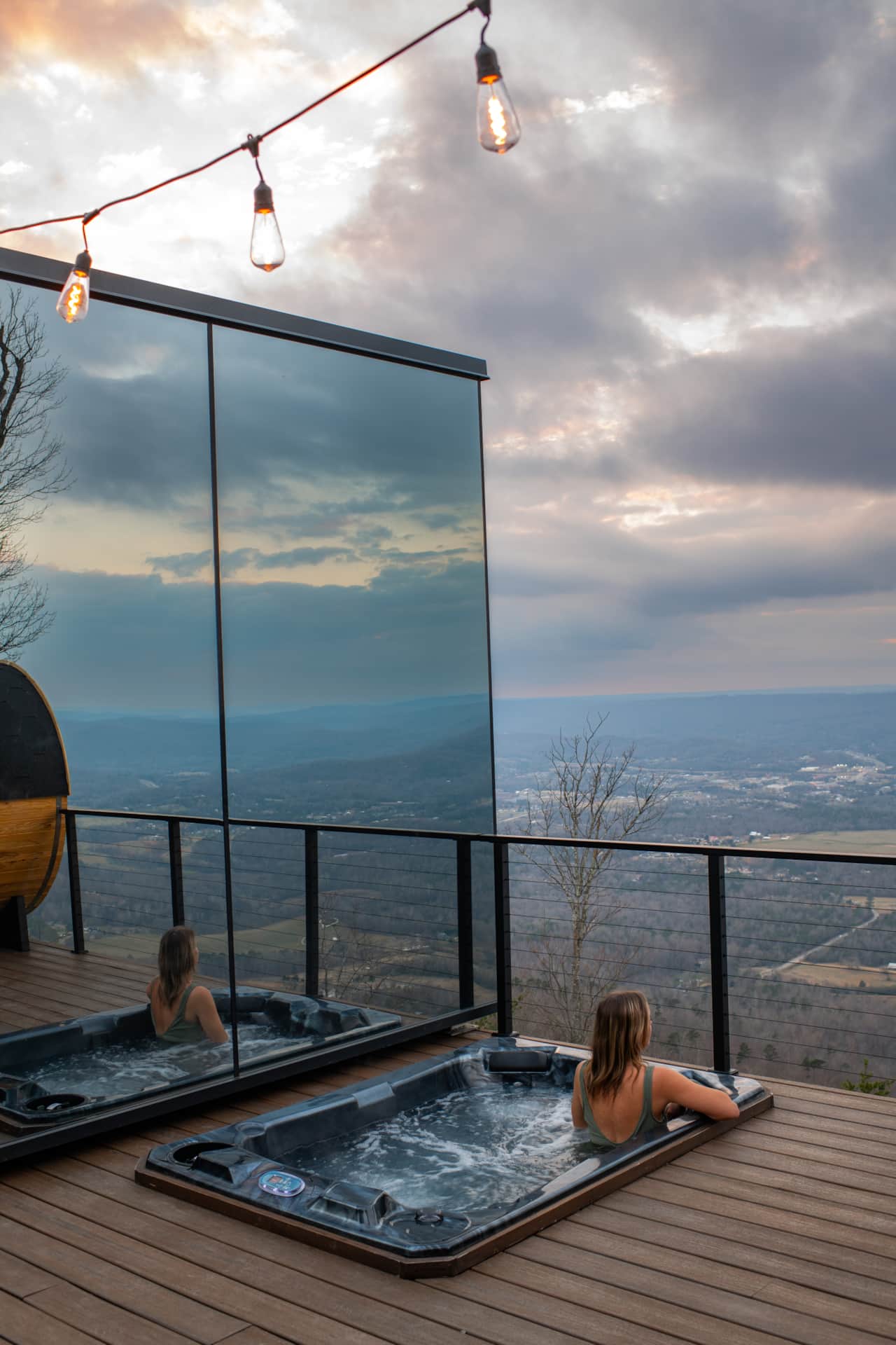 Soaking in the hot tub with sweeping mountain views stretching out into the horizon.