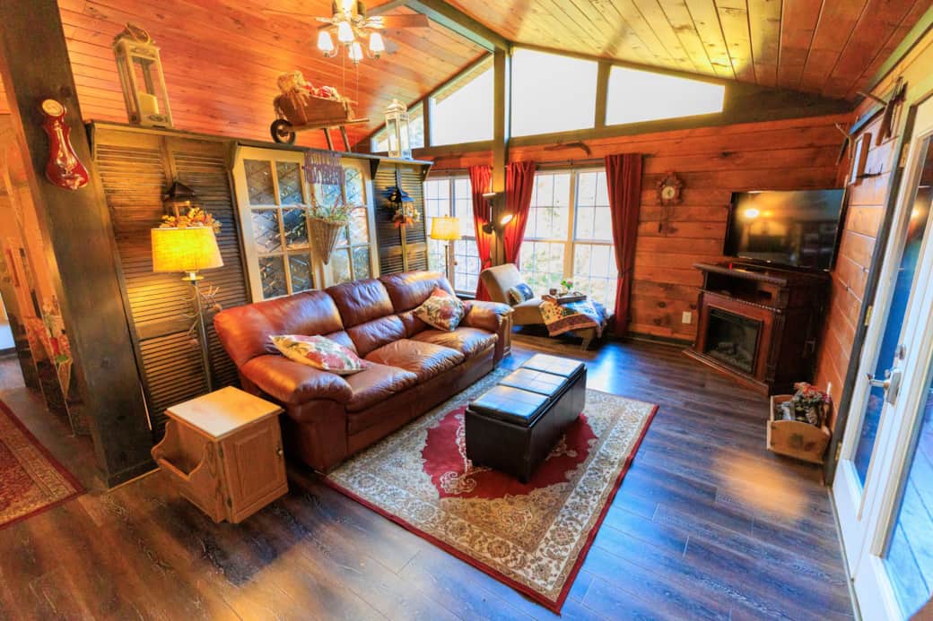Living room facing back windows and fireplace