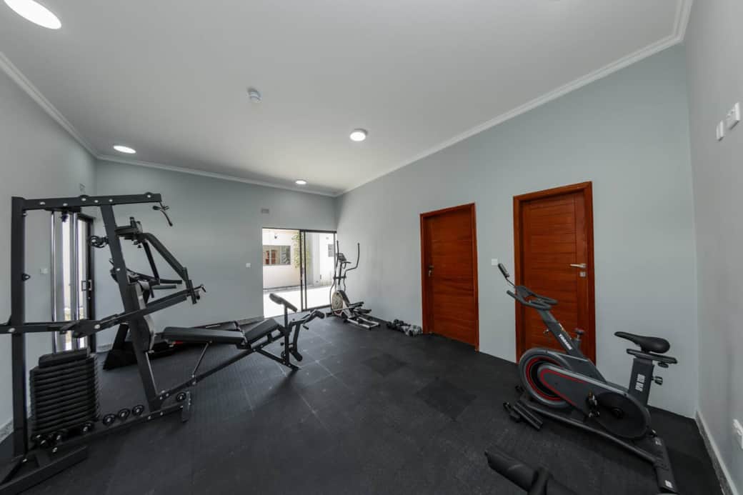 On-site fitness room with cardio and strength equipment 