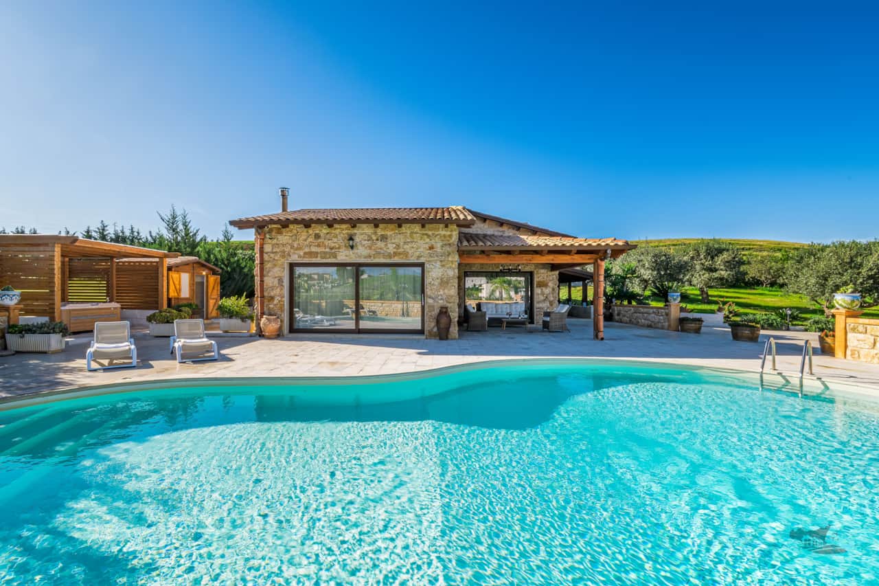 Your own private retreat surrounded by nature: a sparkling pool, hot tub and relaxing patio.