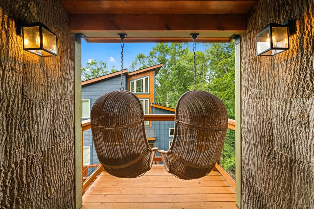Relax on two additional egg swings among a tree bark backdrop Relax on two additional egg swings among a tree bark backdrop
