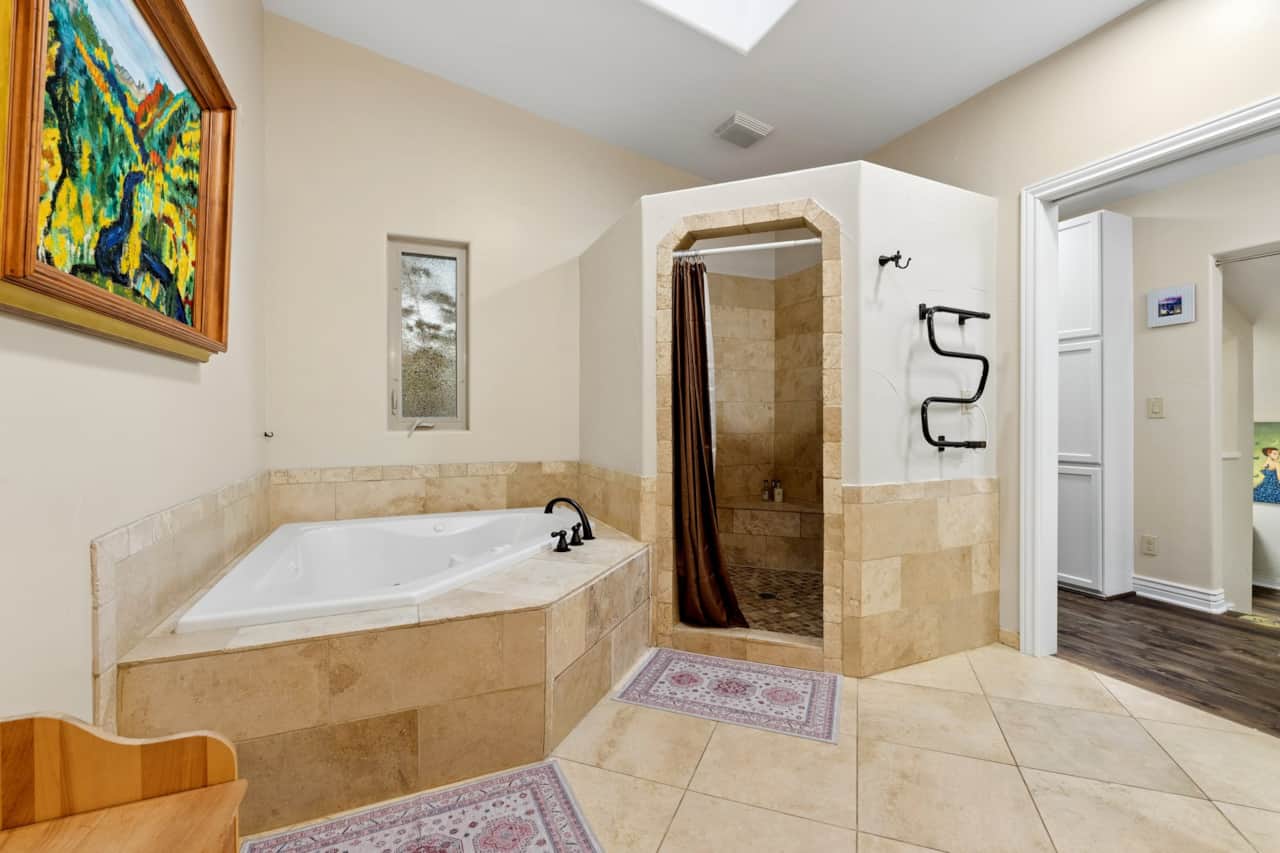 Ensuite spa bath — jetted soaking tub and two-person shower