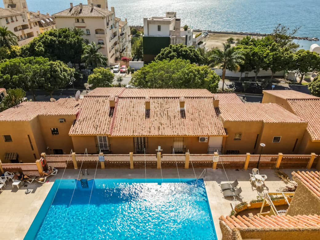 The Community pool, with provate sunloungers. And chairs around. 
