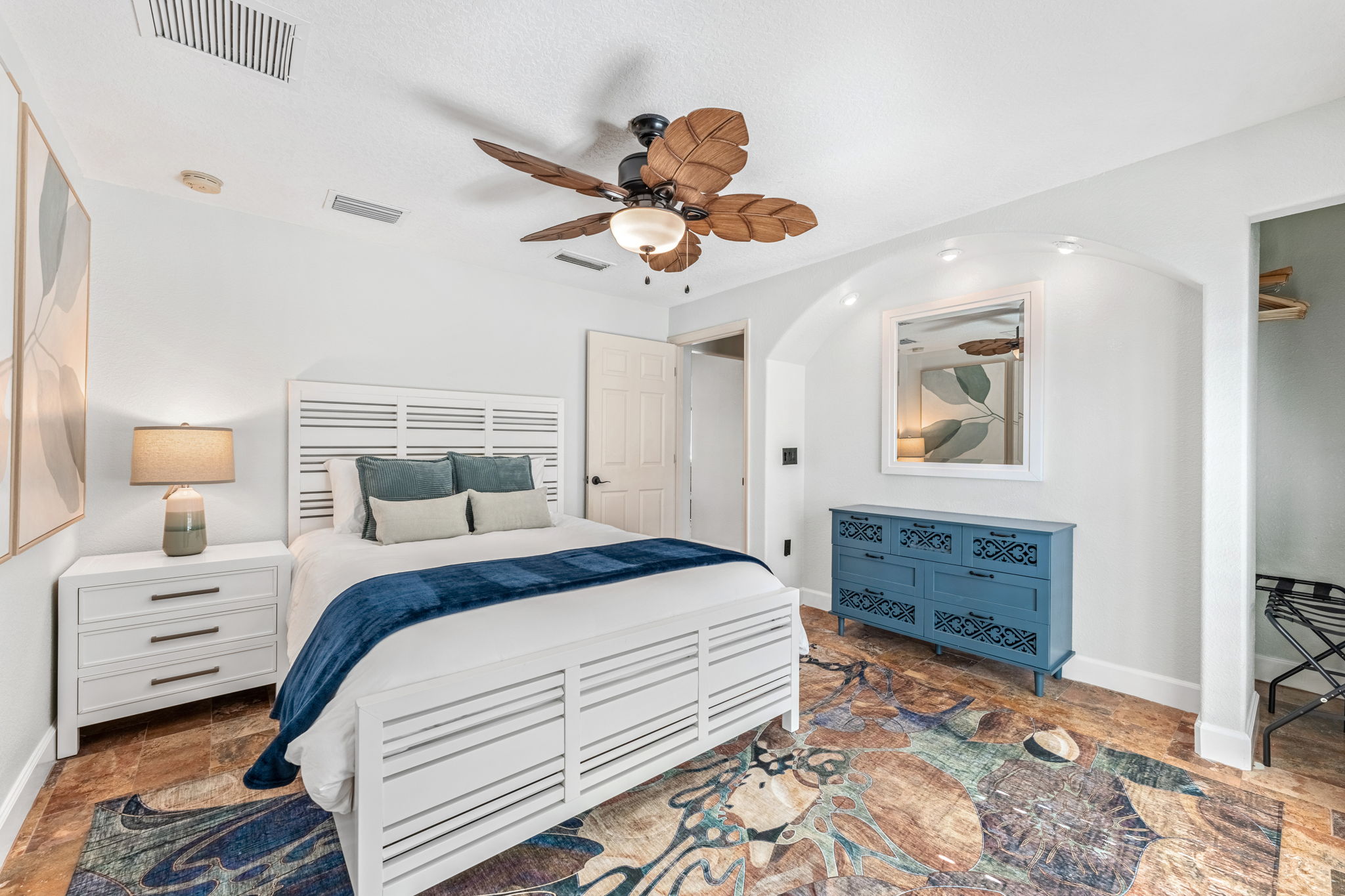 Rest easy in this cozy bedroom 2, featuring a queen size bed and tasteful decor.
