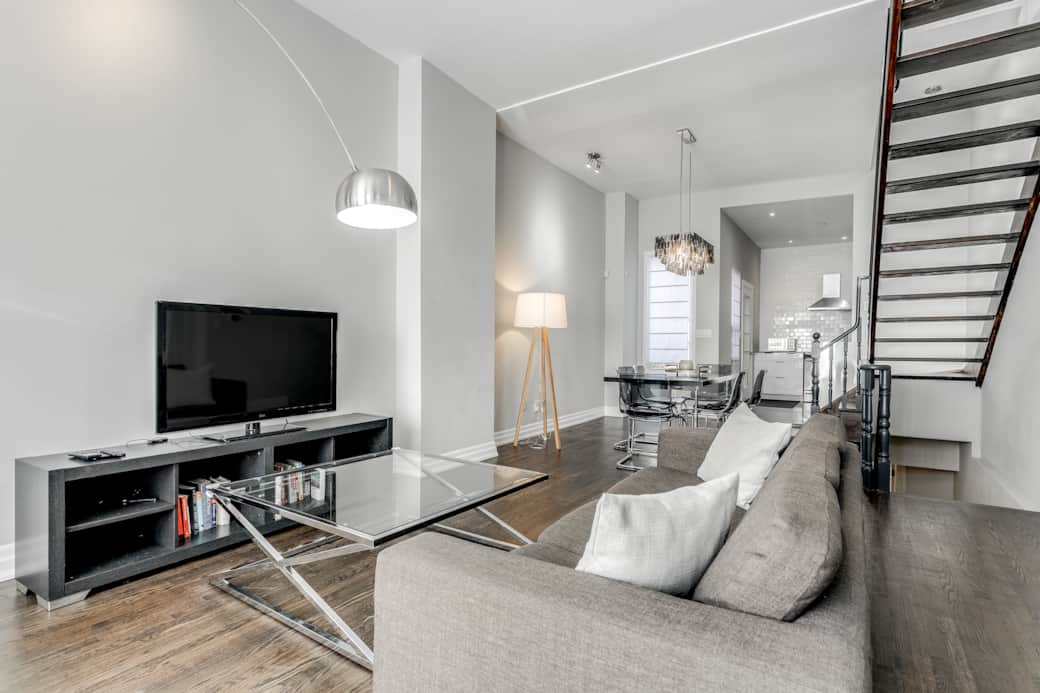 Illuminated and spacious living room in a Toronto high-end short-term rental.