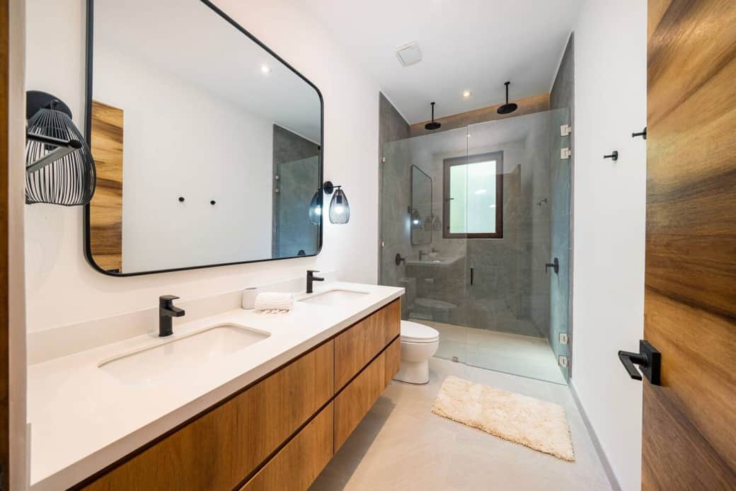 King Bathroom downstairs with double shower head.