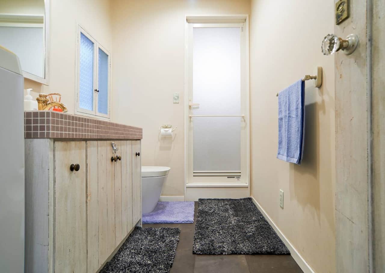 A unique blend of rustic charm and modern convenience, this bathroom offers comfort with style