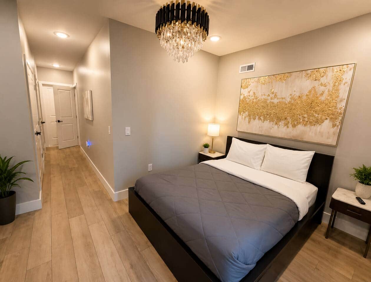 master bedroom featuring a comfortable queen-size bed, elegant décor, and a relaxing atmosphere for a restful night’s sleep. Enjoy the convenience of two separate his-and-her closets, providing ample storage space for longer stays.