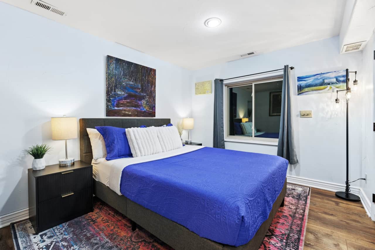 Queen bedroom with original Colorado art