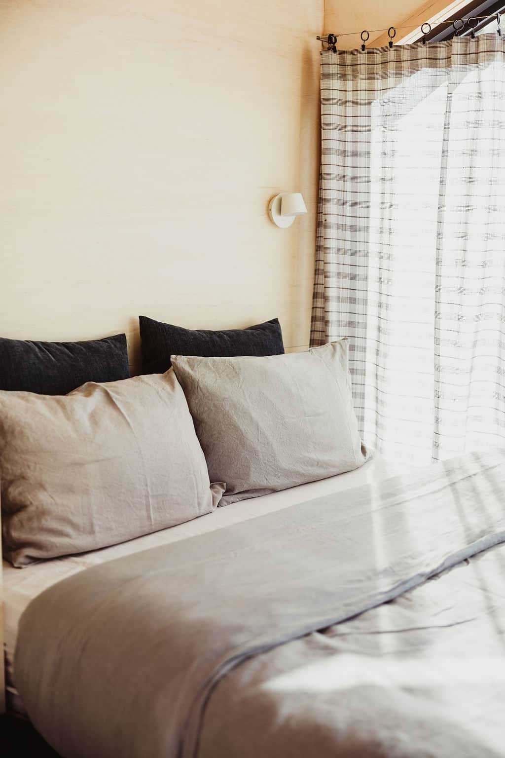 Comfortable queen bed with mountain views