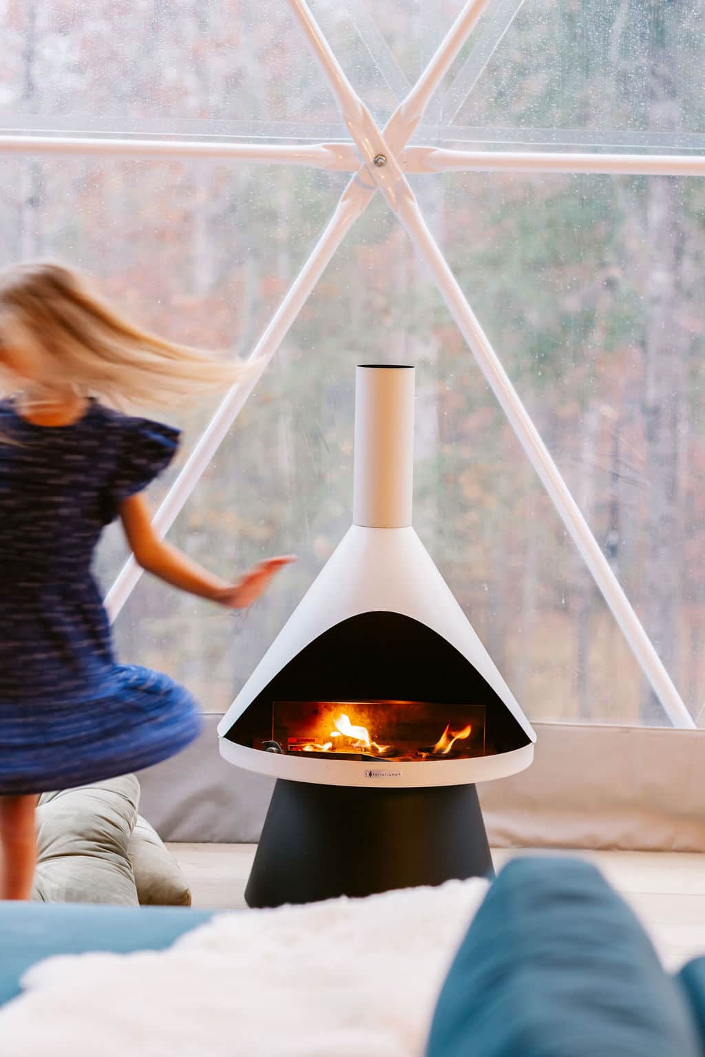 Cozy indoor fireplace inside the Lake Martin glamping dome