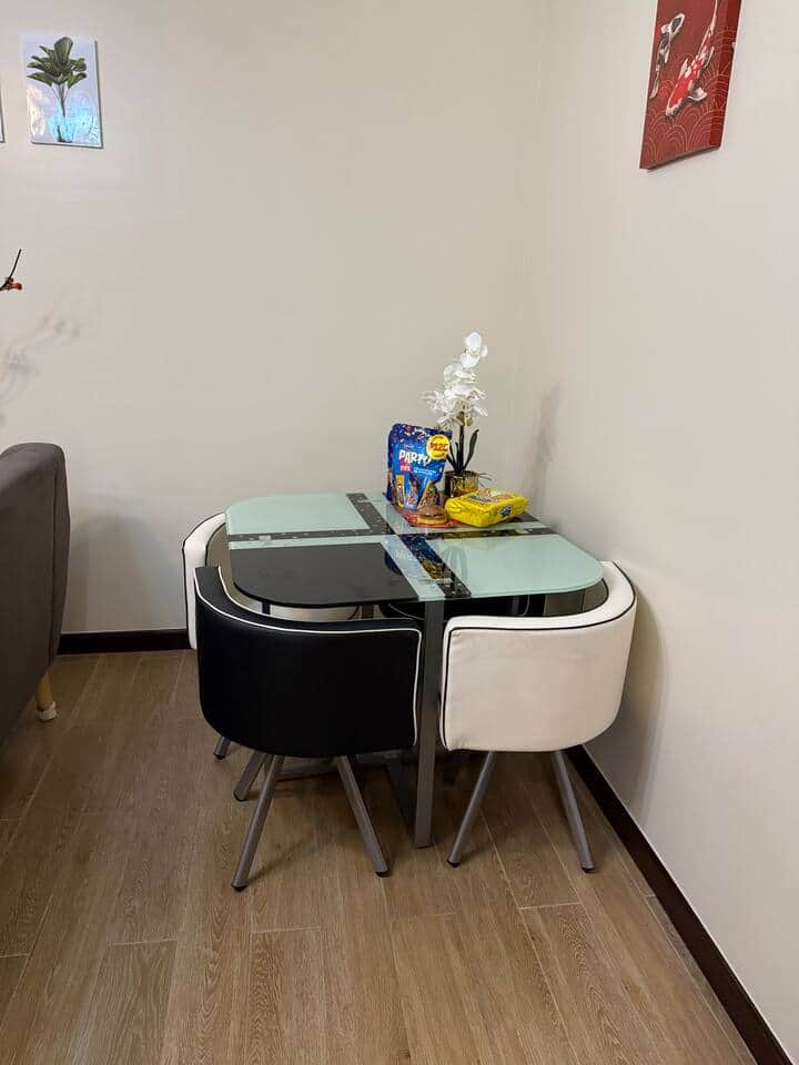 Cozy dining area with a 4-seater table and chairs that tuck neatly under to save space. Perfect for meals, coffee breaks, or working comfortably while keeping the area open and airy.
