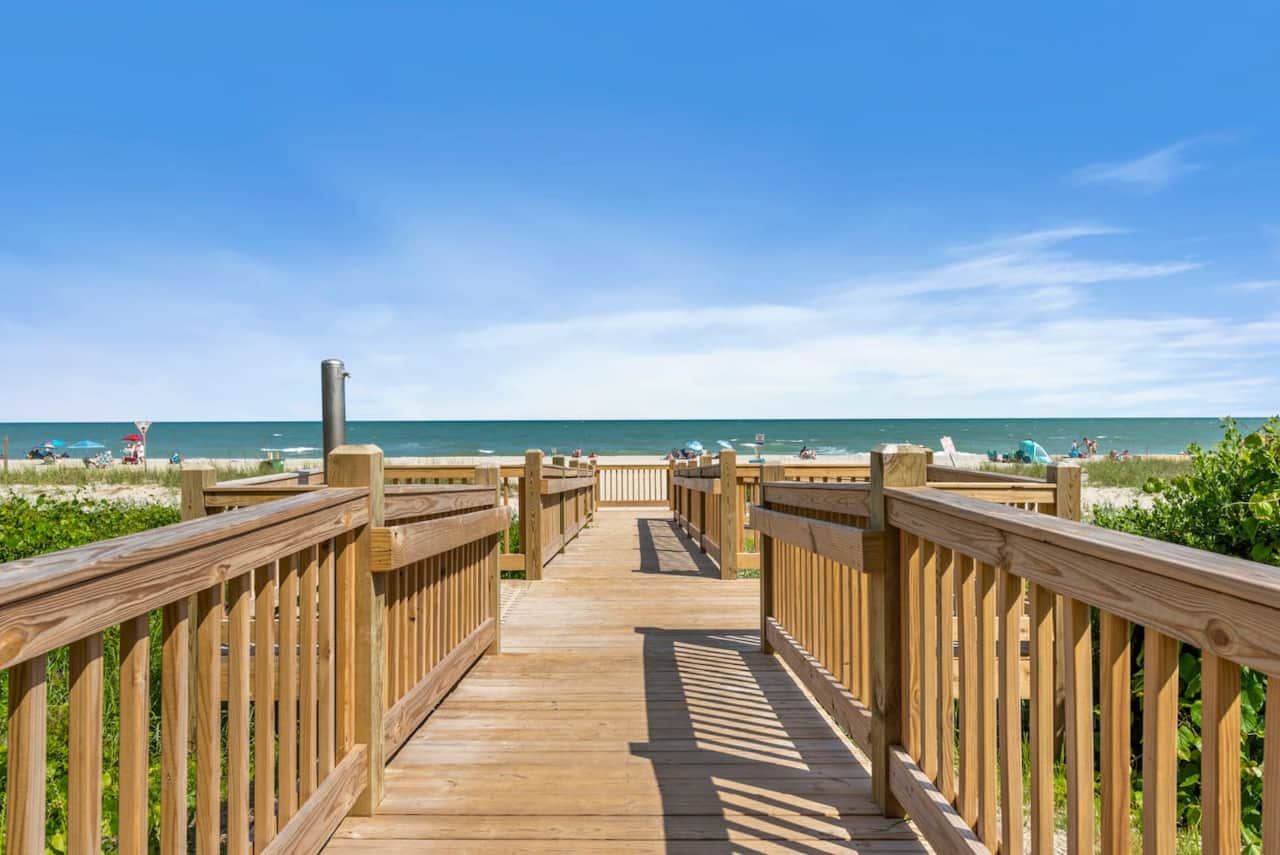 Private beach access just steps away — stroll down the boardwalk and straight onto the sand for a perfect day by the ocean. ☀️️