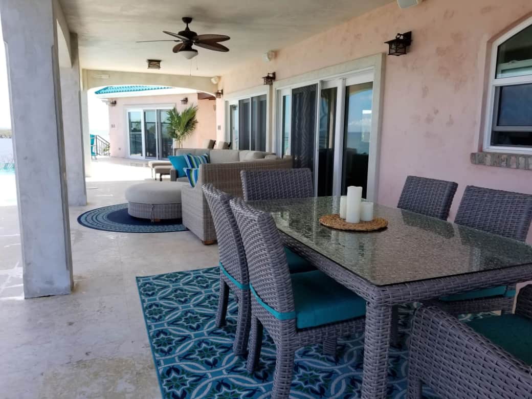Outdoor dining area on the pool patio