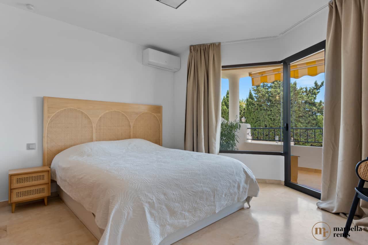 Master bedroom with private balcony. 
