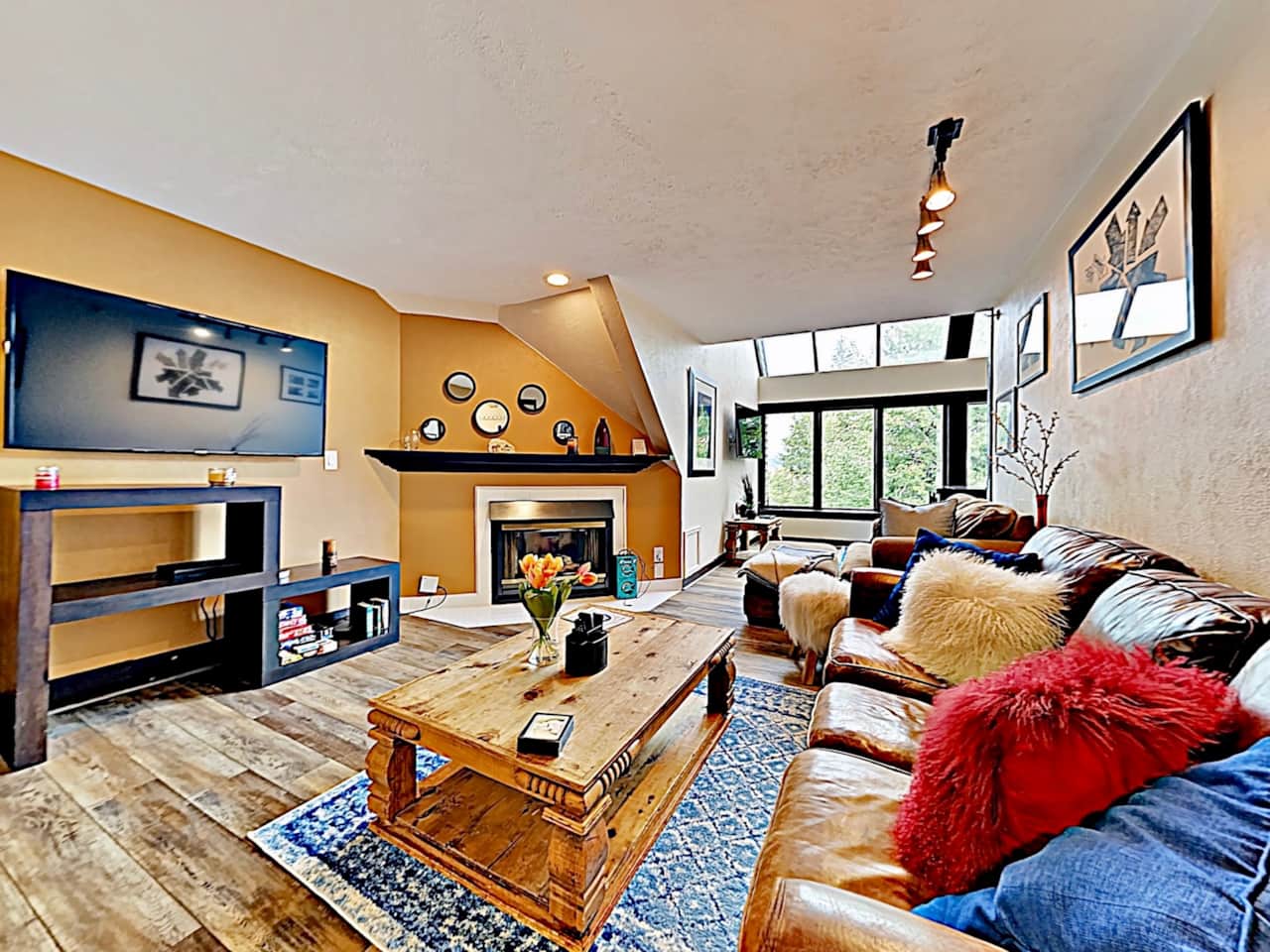living room with Large HD Smart TV & fireplace