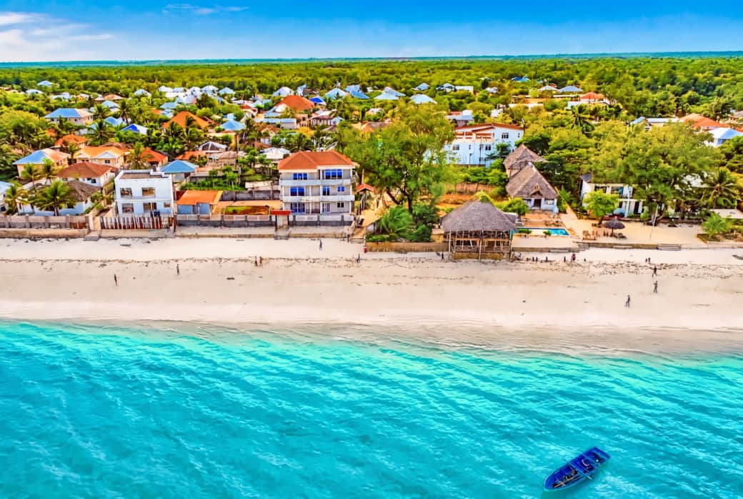 Aerial views of Uroa Beach, Zanzibar — turquoise waters, white sand, and our beachfront home. 🌊" (