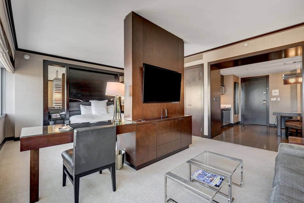 Open Room Layout with Lounge, TV and Strip-Facing Windows Open Room Layout with Lounge, TV and Strip-Facing Windows