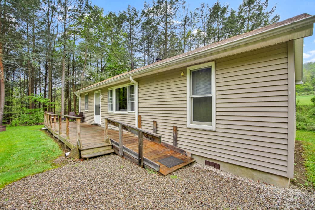 Entrance for Plank Road Retreat will be on the 'back' side of the home, follow the ramp. 