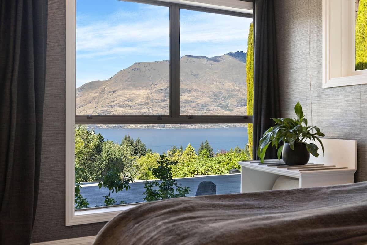 Separate main bedroom with Lake Wakatipu views at Walk to Town 41B Alpine Chalet Queenstown