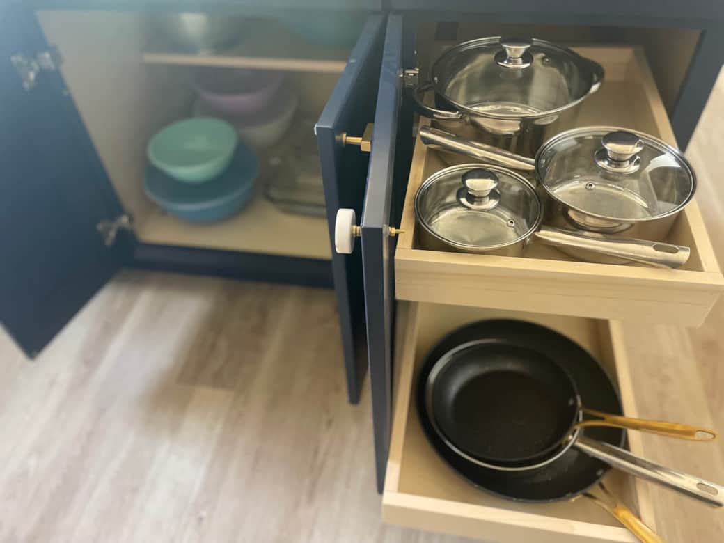 Pots, pans, mixing bowls, strainer, and oven-safe glass bakeware
