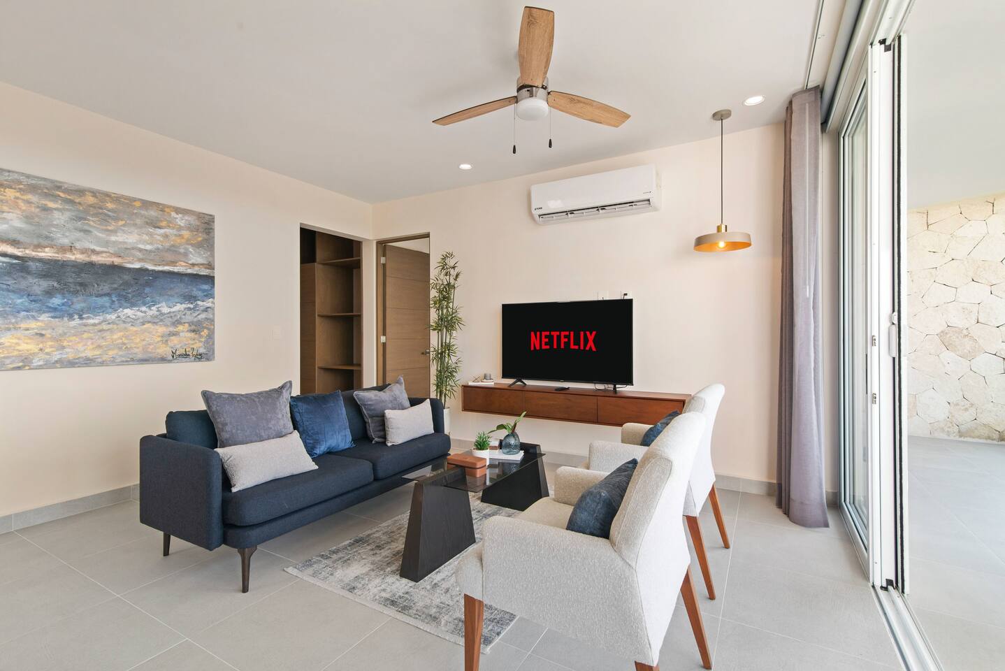 Kick back on the comfortable sofa and stream your favorite shows on the Smart TV. This inviting space features AC, a ceiling fan, and large sliding glass doors with direct access to your private balcony, creating the perfect indoor-outdoor retreat.