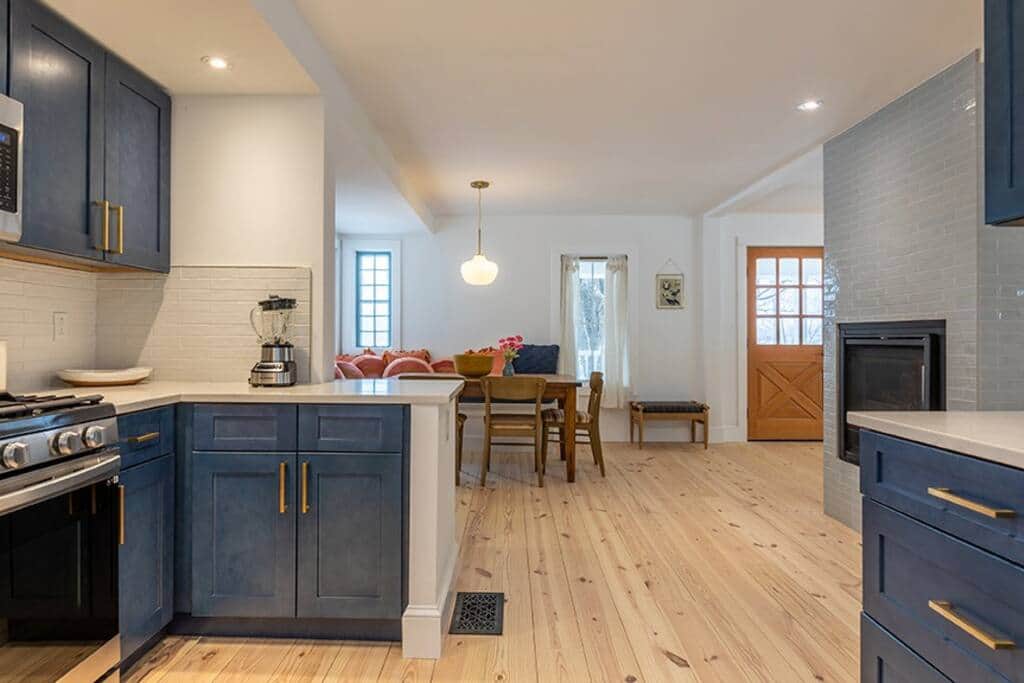 Kitchen view to breakfast nook and standing double sided fireplace Kitchen view to breakfast nook and standing double sided fireplace