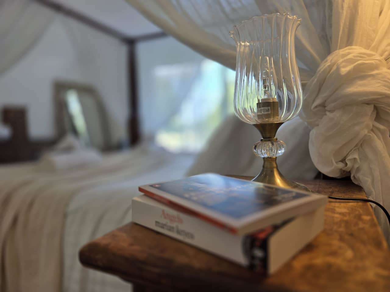 Retreat to our serene, romantic bedroom sanctuary with a stunning four-poster canopy bed.