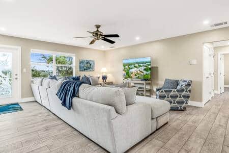 Front entrance and spacious living room  with Smart TV for downtime relaxation