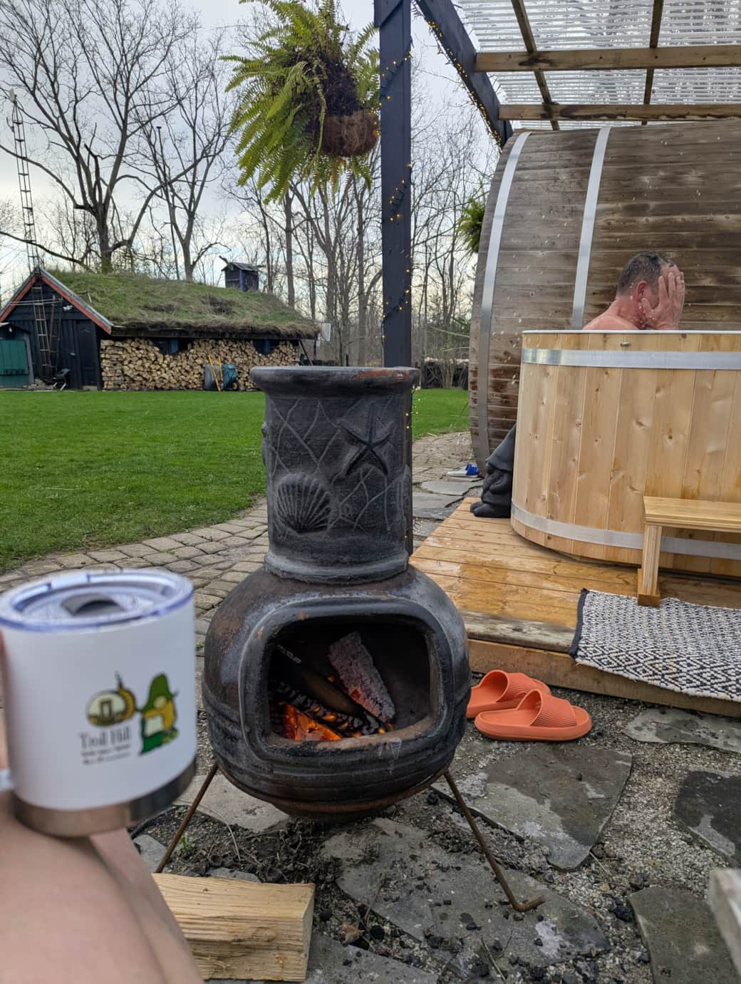 Chiminea with chairs by plunge and sauna