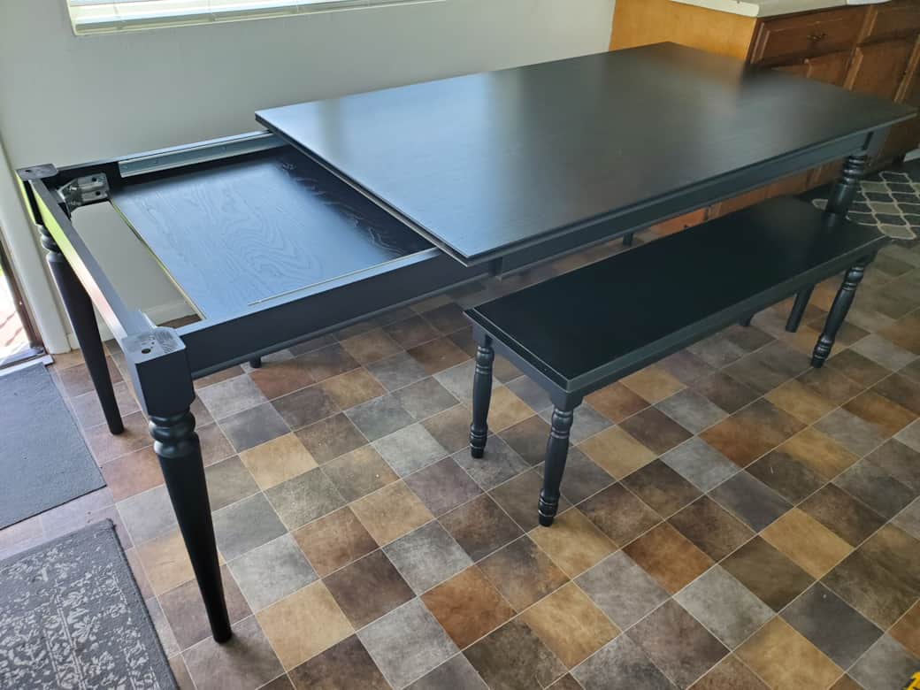 An extendable table (new in 2025) adds more table space and seating.