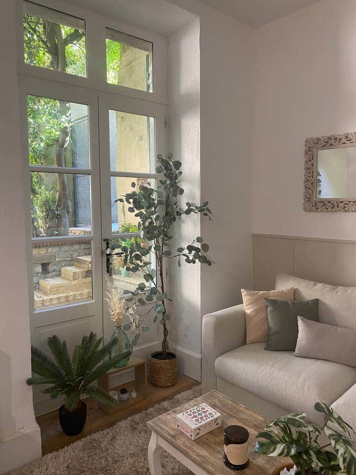 Large windows and stylish furnishings fill this living space with light and warmth in Carcassonne. Large windows and stylish furnishings fill this living space with light and warmth in Carcassonne.