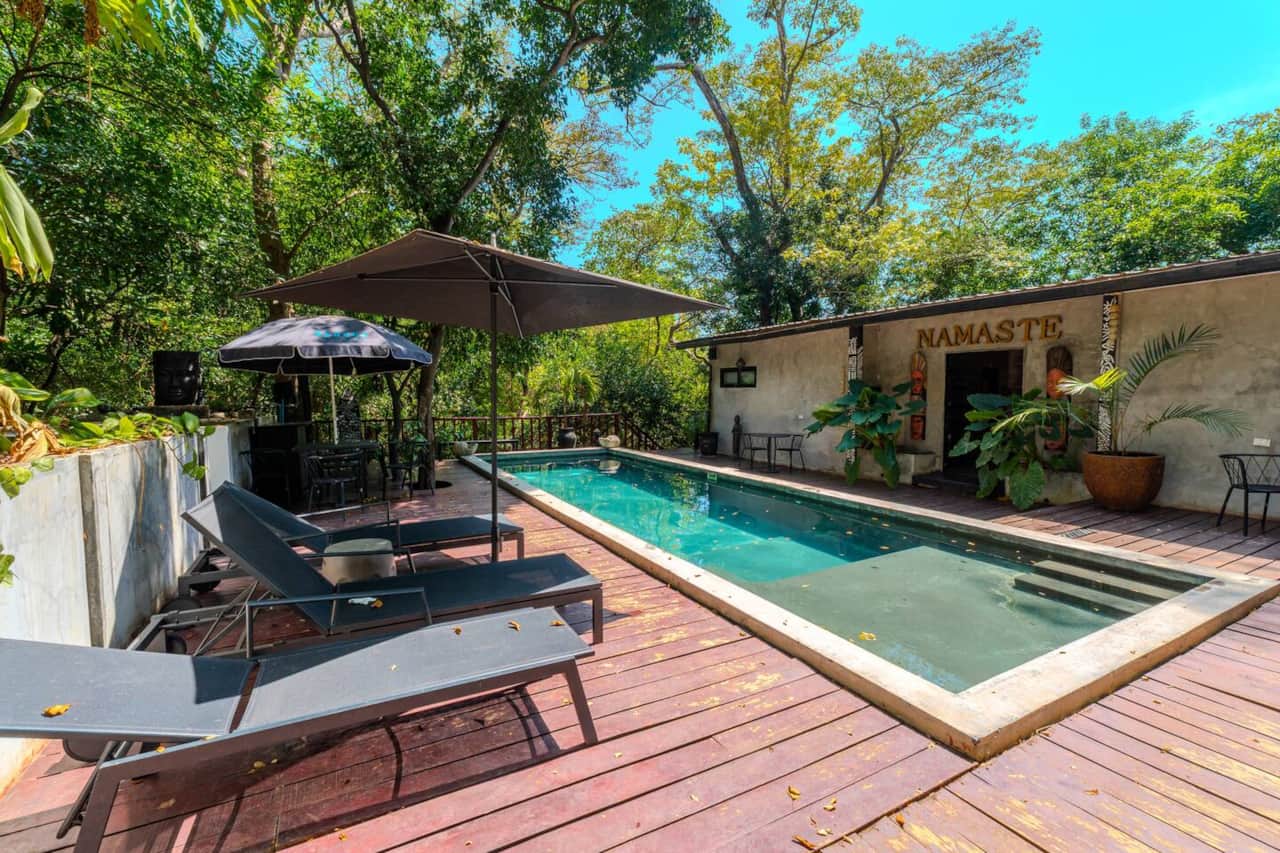 Saltwater pool and sun loungers on the wooden deck of Saboga Lodge, Saboga Island, Panama