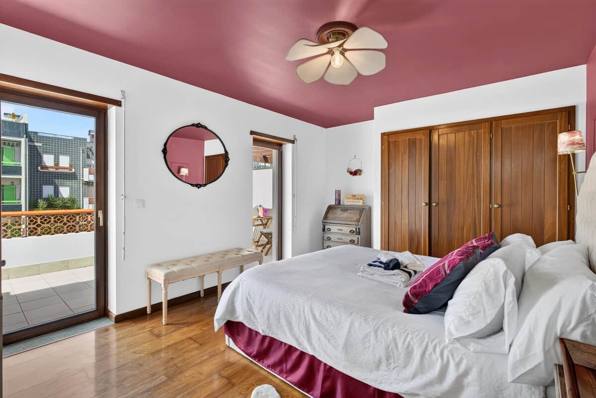 Bright, spacious Porto Room with a queen bed, large built-in wardrobes, and private terrace.