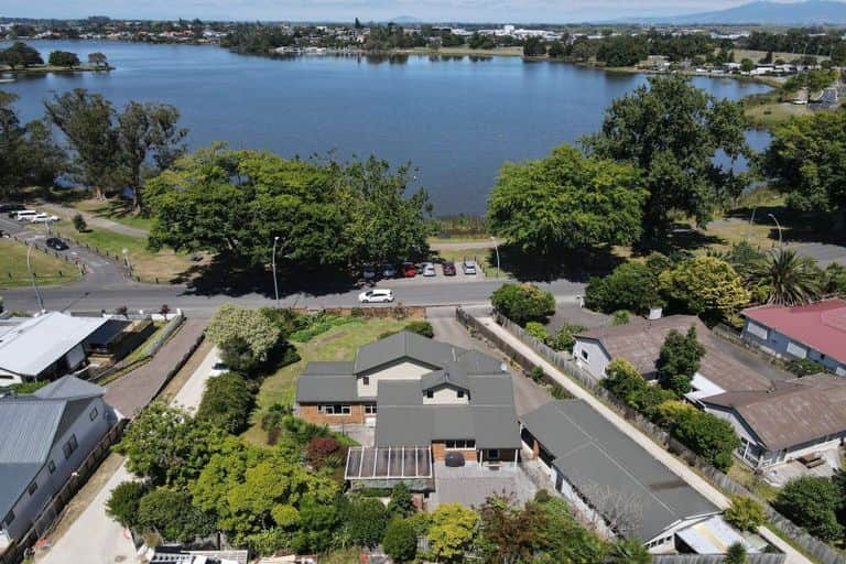 Nestled directly across from the lake, this spacious home offers unmatched views and unbeatable access to nature. Enjoy morning walks along the waterfront, or simply admire the lush surroundings from nearly every room.