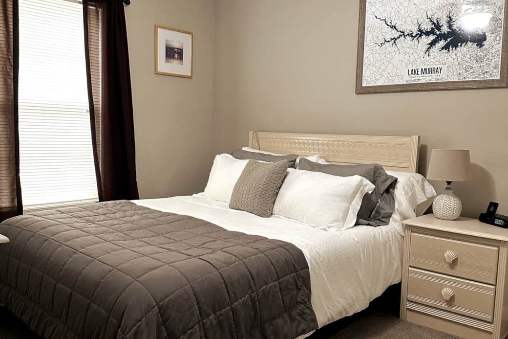 Bedroom featuring Casper-type Foam Mattress, three choices of pillow firmness, and large 4K TV. 